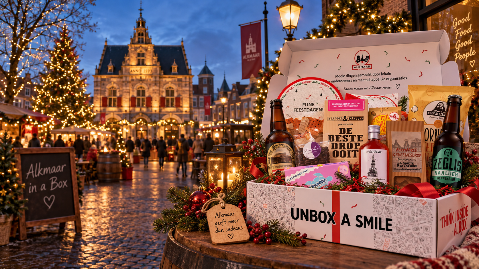 Alkmaar in a Box Christmas hamper at the atmospheric Christmas market on Waagplein, with the Waag and a lit Christmas tree in the background
